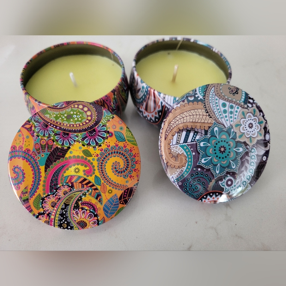 Two soy wax tin candles in decorative, mandala-print tins. New.